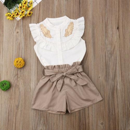 Stevvex baby girl two-piece outfit: ruffled top with gold feather embroidery, tan bow shorts on Tampa Home & Garden Store