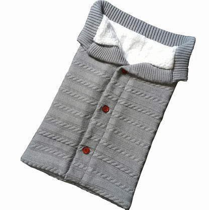 Swaddle blanket Stevvex gray knit exterior with white fleece lining and red buttons on Tampa Home & Garden Store