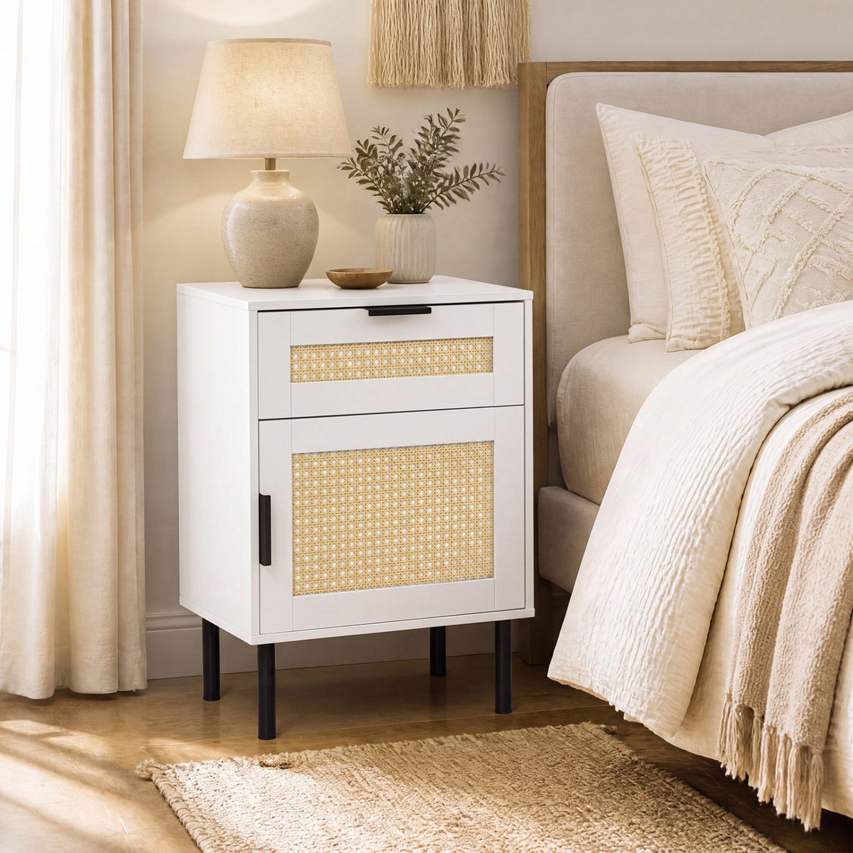 White rattan nightstand with cane-weave panels, two drawers and cabinet, black legs on Tampa Home & Garden Store
