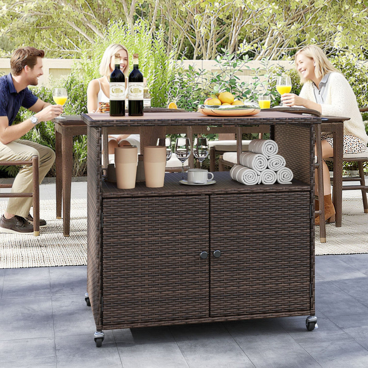 Outdoor storage cabinet with acacia wood top by DirectDeals in wicker, two wine bottles on top on Tampa Home & Garden Store