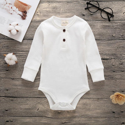 Baby bodysuit romper Stevvex white ribbed with long sleeves and chest buttons, bottom snaps on Tampa Home & Garden Store