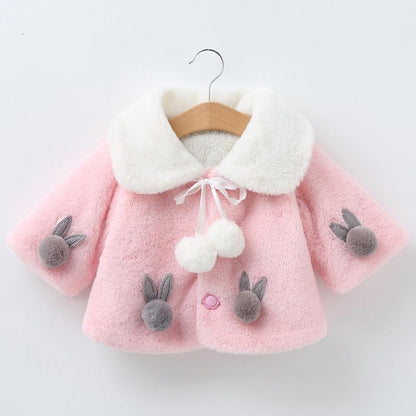 Stevvex pink baby coat with white faux fur collar, bunny appliques on sleeves and pom-pom ties on Tampa Home & Garden Store
