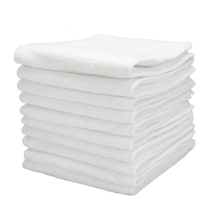 White towels stack, soft terry cloth on Tampa Home & Garden Store