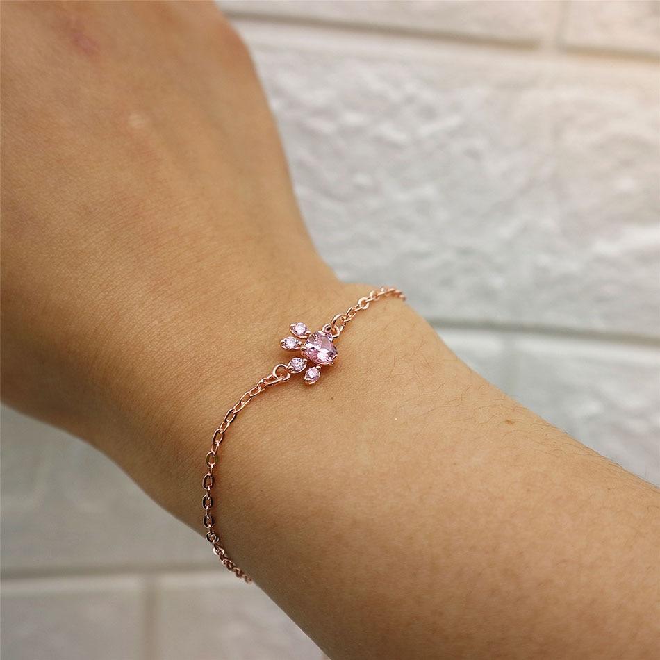 Bracelet Stevvex rose gold with pink crystal flower charm on delicate chain worn on wrist on Tampa Home & Garden Store