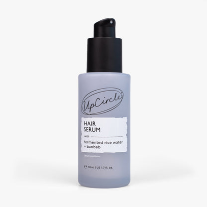 Hair Serum by UpCircle bottle with pump, gray label featuring fermented rice water + baobab on Tampa Home & Garden Store