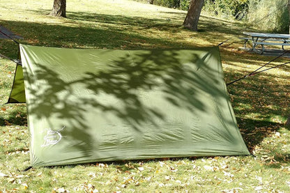 Hammock Rain Fly River Country Gear green tarp set up on grass at a campsite on Tampa Home & Garden Store