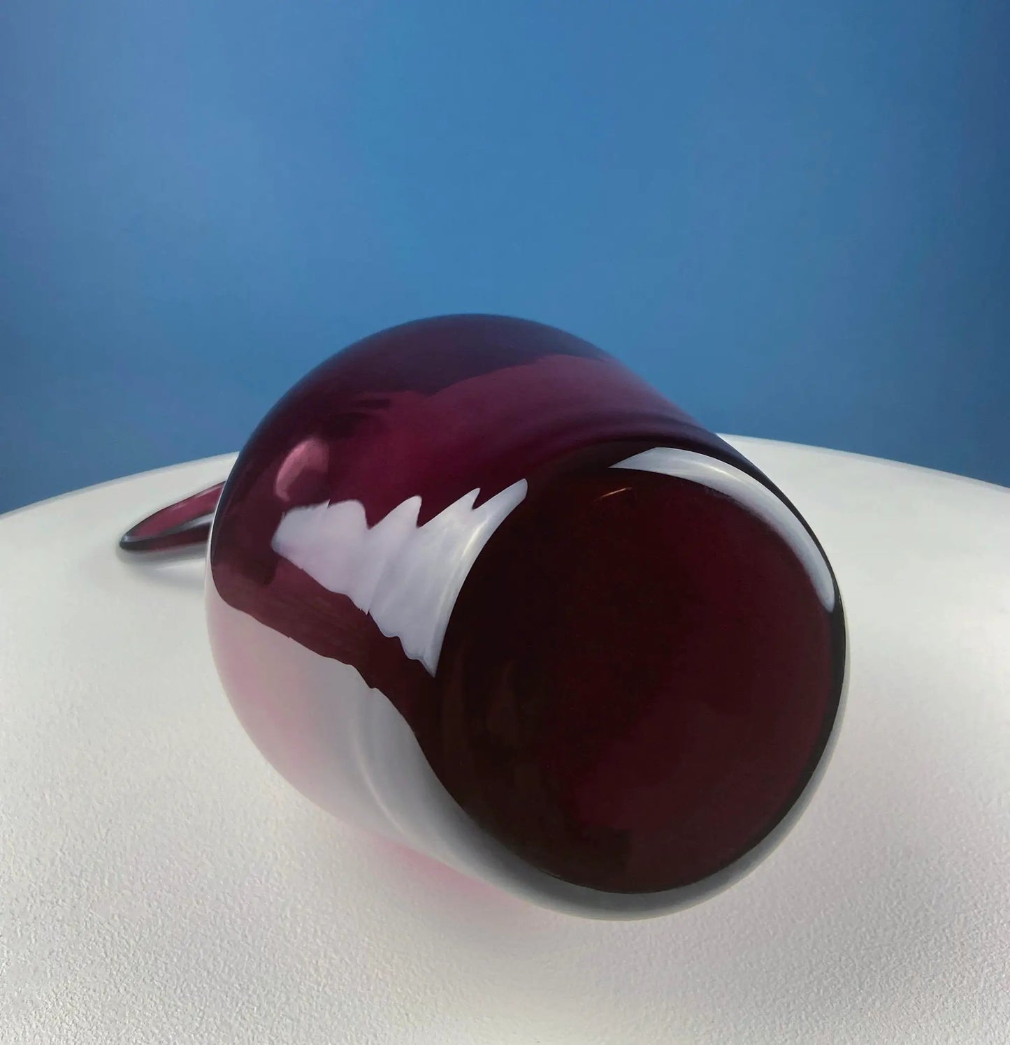 Hand blown purple glass pitcher vase centerpiece with a white jagged band and aubergine hue on Tampa Home & Garden Store