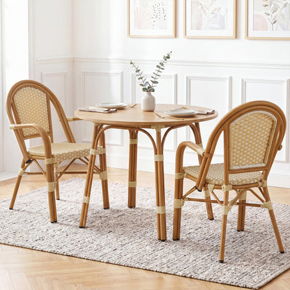 Set of 2 yellow PE wicker bistro dining chairs around a round table on Tampa Home & Garden Store