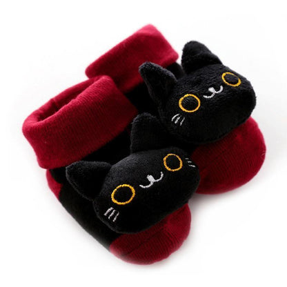 Stevvex baby non-slip socks with plush black cat faces and yellow eyes on red base on Tampa Home & Garden Store