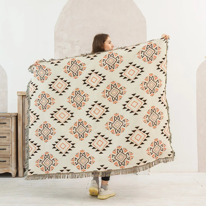 DecorBites Knitted Nordic Plaid Blanket with cream base, peach geometric motifs and fringe on Tampa Home & Garden Store