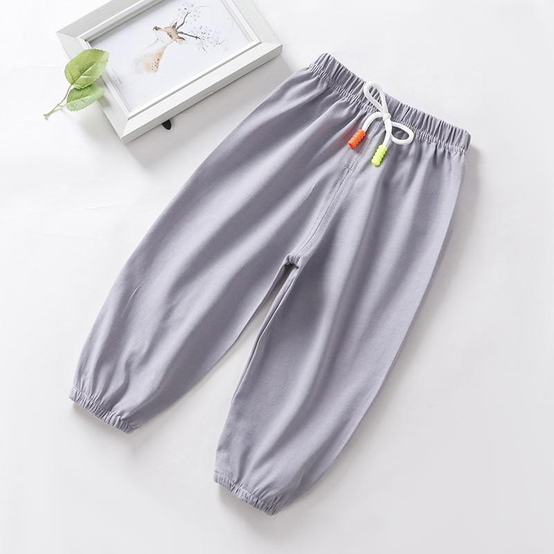 Baby boy sleep pants Stevvex anti mosquito gray with white drawstring and orange lime tassels on Tampa Home & Garden Store