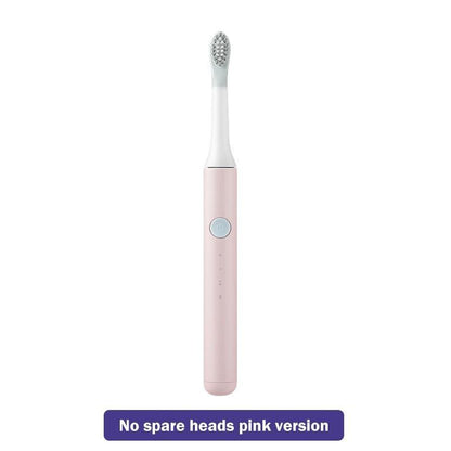 Pink electric sonic toothbrush with white brush head and single power button, travel-friendly on Tampa Home & Garden Store