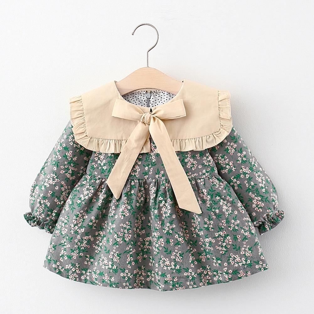 Modern Retro Girl Dress Stevvex green floral print with beige collar and bow, puff sleeves on Tampa Home & Garden Store