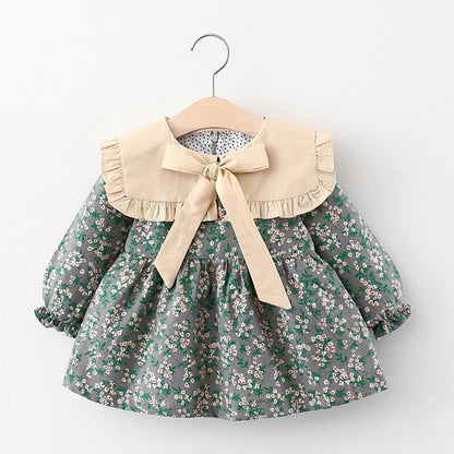 Modern Retro Girl Dress Stevvex green floral print with beige collar and bow, puff sleeves on Tampa Home & Garden Store