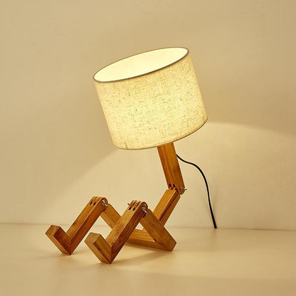 Table lamp Stevvex wooden robot-shape folding base with linen shade on Tampa Home & Garden Store
