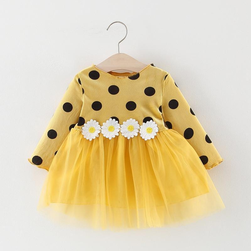 Stevvex yellow infant dress with black polka dots and white daisy belt over a tulle skirt on Tampa Home & Garden Store