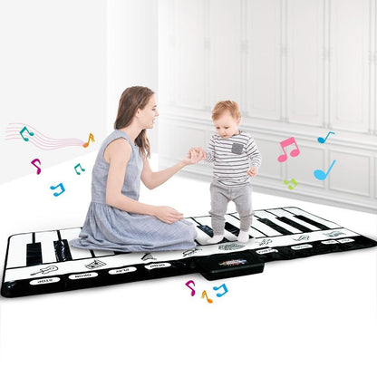 Electronic piano mat for kids by Stevvex, black-and-white keyboard surface; playing on Tampa Home & Garden Store
