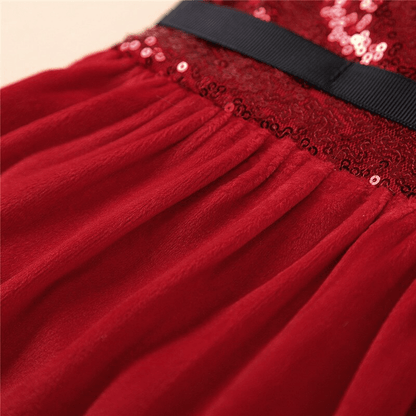 Stevvex baby girls red velvet Christmas romper dress with sequin bodice and black sash on Tampa Home & Garden Store