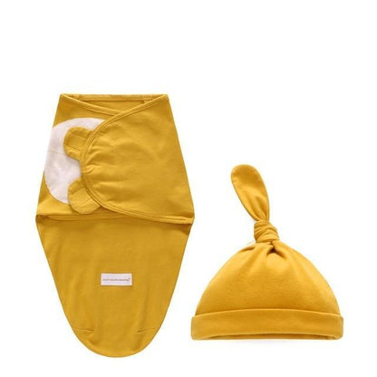 Two-piece newborn swaddle wrap and knotted hat set in mustard yellow by Stevvex on Tampa Home & Garden Store