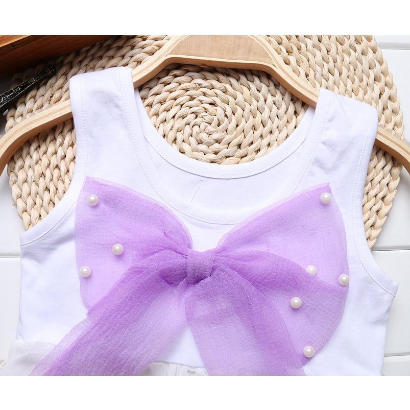 Stevvex baby sleeveless white dress with purple bow and pearl beads ST15BY21435ASRIN on Tampa Home & Garden Store