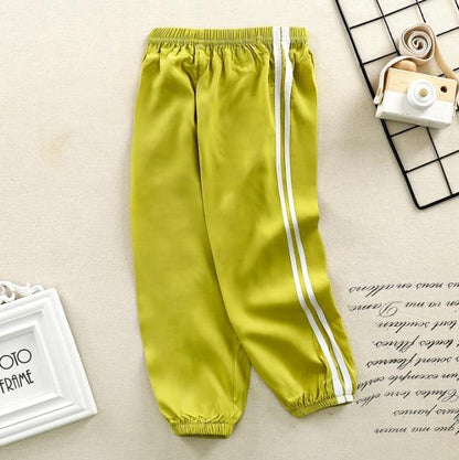 Stevvex kids sports pants lime green with white side stripes, elastic waist and cuffs on Tampa Home & Garden Store