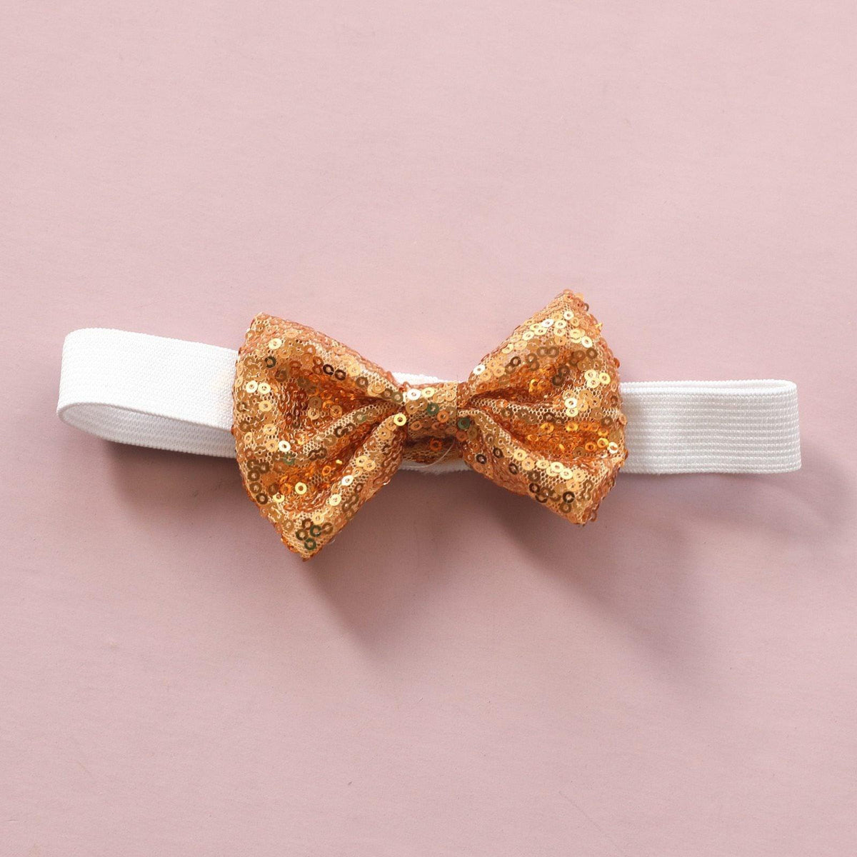 White elastic baby headband with a gold sequin bow by Stevvex on Tampa Home & Garden Store