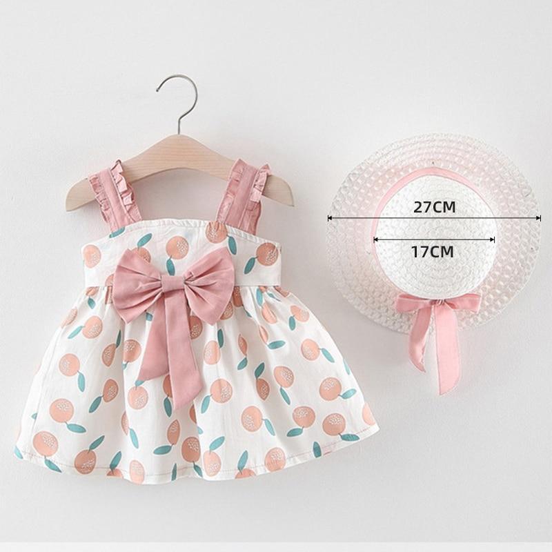Baby girl cherry-dot dress set with pink sash and pink straps, plus straw hat with ribbon on Tampa Home & Garden Store
