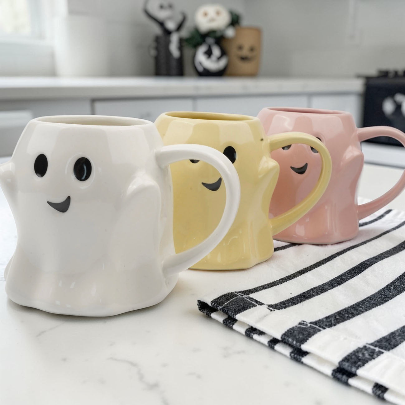 Ghost Mug set by Gia Roma; 3 pastel ghost mugs in white, yellow, and pink with smiling faces on Tampa Home & Garden Store