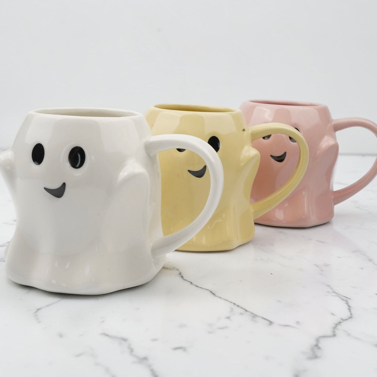 Ghost Mug trio in white, pale yellow, and pink with friendly ghost faces Gia Roma coffee mugs on Tampa Home & Garden Store