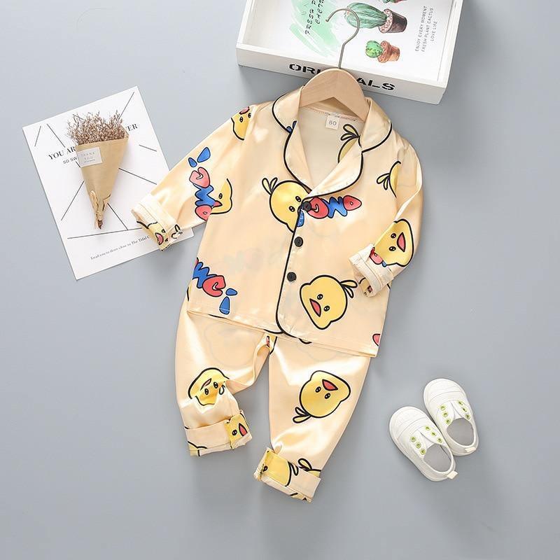 Stevvex kids satin pajama set with cartoon yellow duck print, cream top and pants on Tampa Home & Garden Store