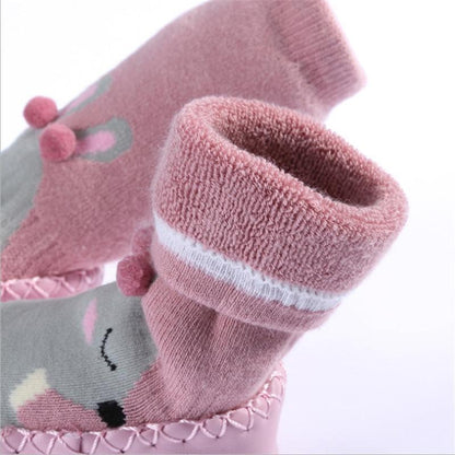 Newborn indoor sock shoes Stevvex pink plush baby socks with grey accents and pink pom poms on Tampa Home & Garden Store