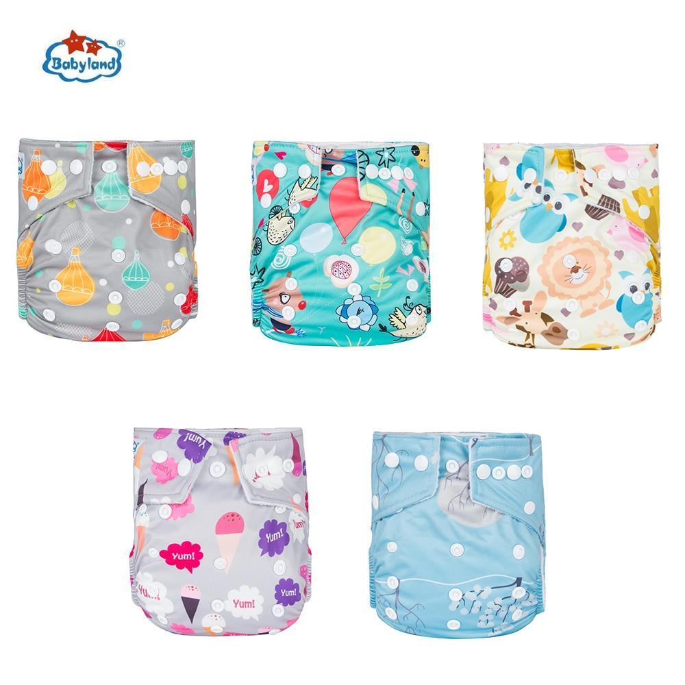 Five Stevvex cloth pocket diapers with bright prints in gray, teal, and pastel yellow/pink on Tampa Home & Garden Store