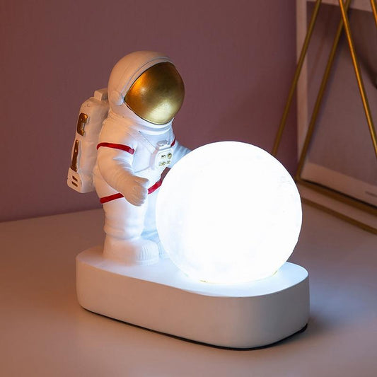 Astronaut night light Stevvex with glowing moon globe on white base desktop bedside decoration on Tampa Home & Garden Store