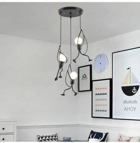 Industrial metal pendant light by Stevvex with black finish, hanging bulbs and cartoon arms on Tampa Home & Garden Store