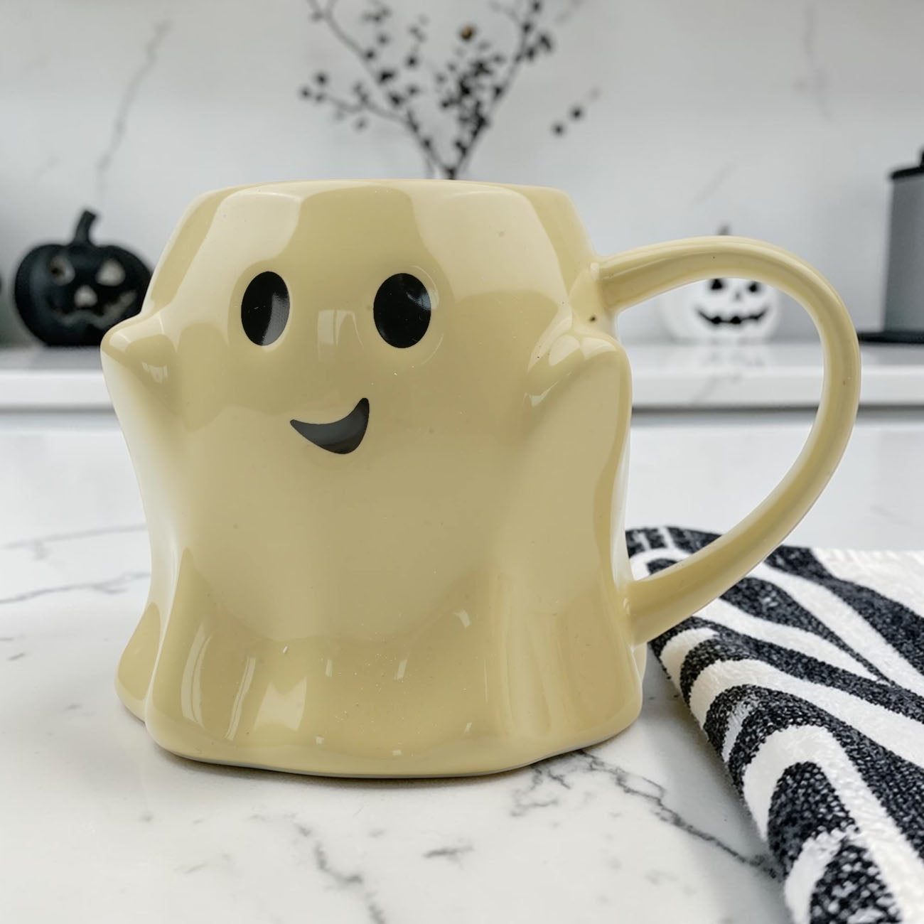 Ghost mug ceramic coffee mug in pale yellow with a cute ghost face and black eyes on Tampa Home & Garden Store
