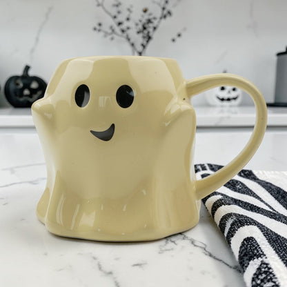 Ghost mug ceramic coffee mug in pale yellow with a cute ghost face and black eyes on Tampa Home & Garden Store