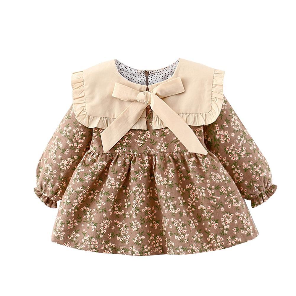 Modern Retro Baby Girl Dress in brown floral cotton with cream yoke and beige bow on Tampa Home & Garden Store