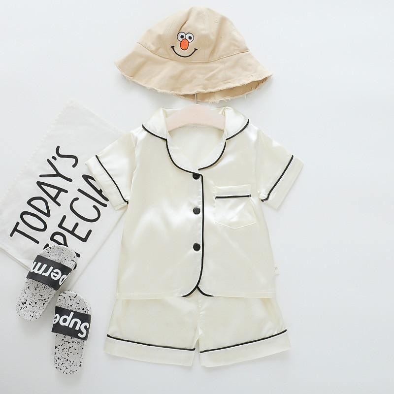 Stevvex ice silk satin kids pajama set with black piping short-sleeve top and shorts hat on Tampa Home & Garden Store