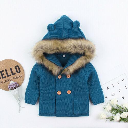 Teal knit hooded baby coat with fur-trim hood and wooden buttons for newborns on Tampa Home & Garden Store