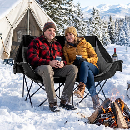 Double camping chair with 4 heating zones in black fabric, two people by campsite campfire on Tampa Home & Garden Store