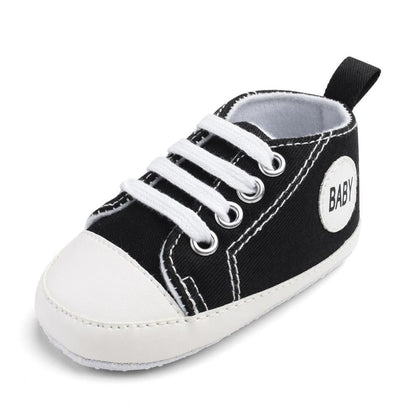 Stevvex baby canvas sneaker, black with white toe cap and laces, side BABY patch on Tampa Home & Garden Store
