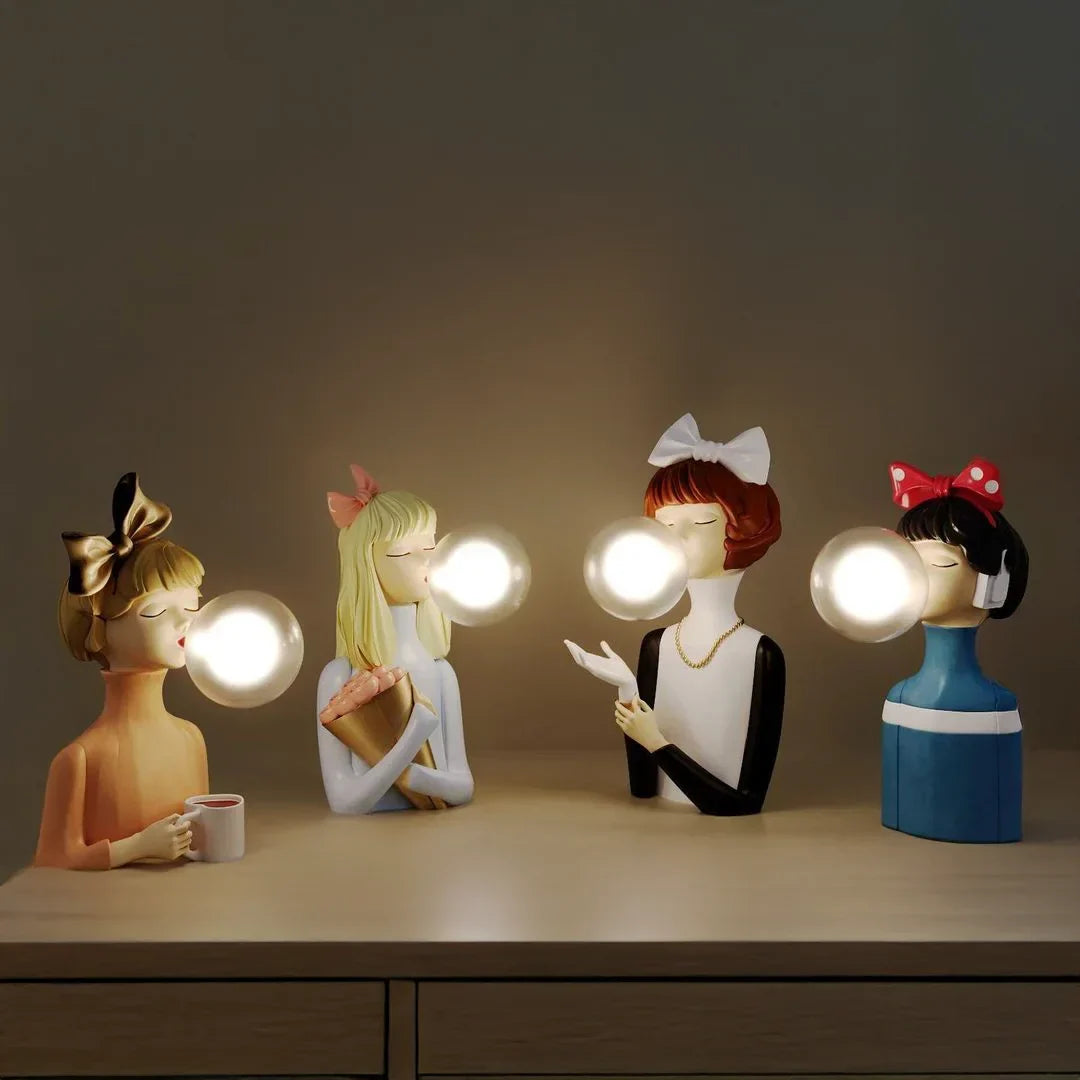 Parisian Bubble Girls Clear Glass LED Table Lamps; four bulb-headed ceramic figurines on dresser on Tampa Home & Garden Store