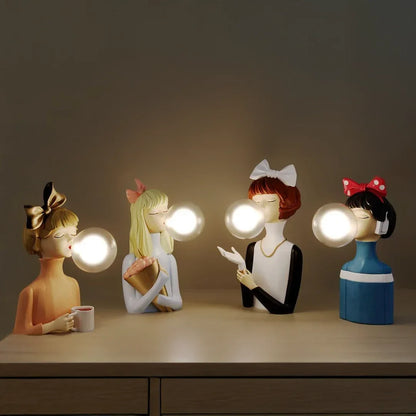 Parisian Bubble Girls Clear Glass LED Table Lamps; four bulb-headed ceramic figurines on dresser on Tampa Home & Garden Store