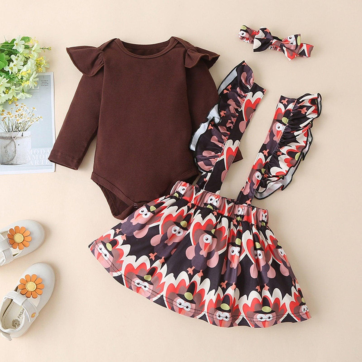 Newborn romper set: brown bodysuit with bold printed dress and matching accessories on Tampa Home & Garden Store