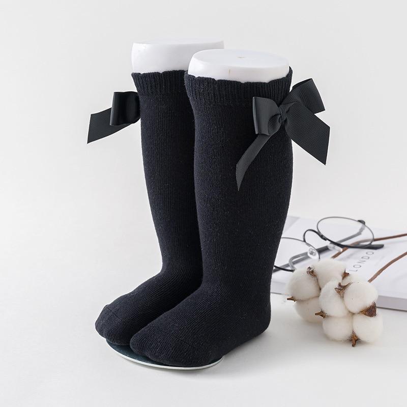 Stevvex baby girls knee-high socks pair in black with large satin bows, soft cotton on Tampa Home & Garden Store
