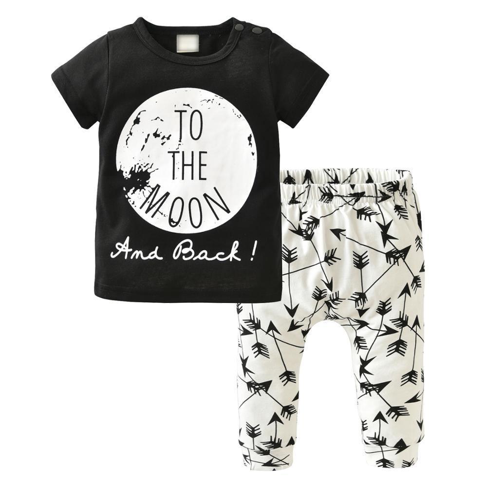 Stevvex 2-piece newborn boy outfit: black tee with moon graphic, white arrow-pattern pants on Tampa Home & Garden Store