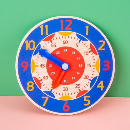 Stevvex Montessori wooden clock toy with blue ring, red inner dial and colorful numbers on Tampa Home & Garden Store