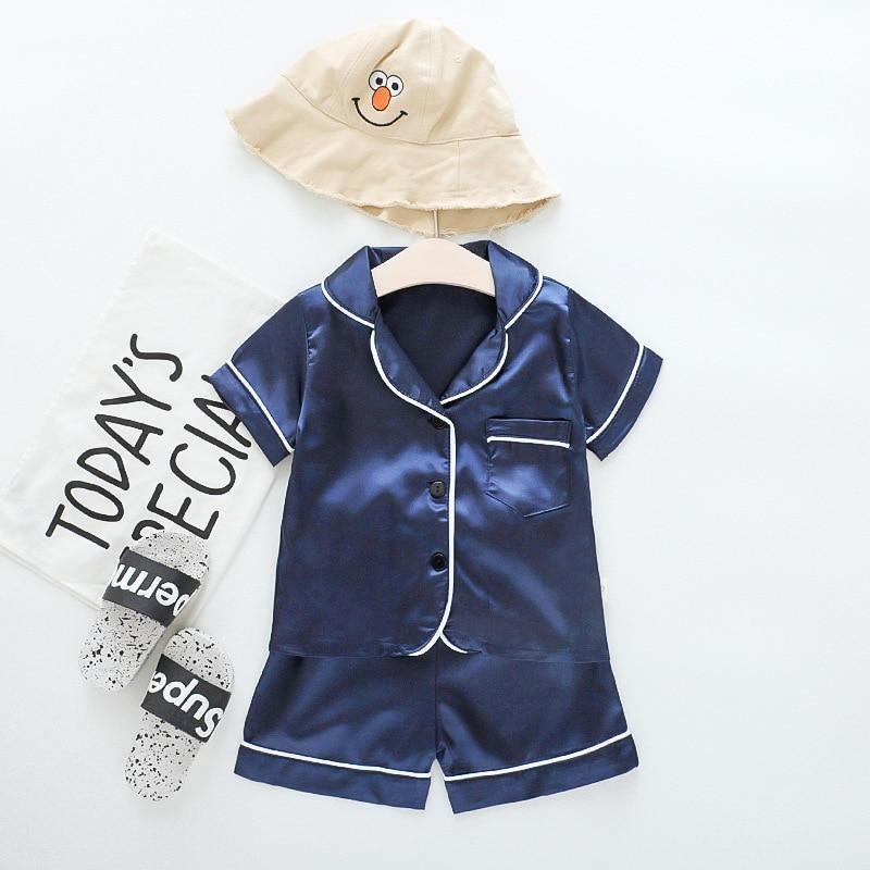 Stevvex navy ice silk satin kids pajama set with white piping (top + shorts) and beige cartoon hat on Tampa Home & Garden Store