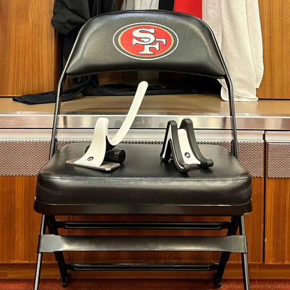 Full Body System muscle release tool Aletha Health on a black chair with a red SF logo on Tampa Home & Garden Store