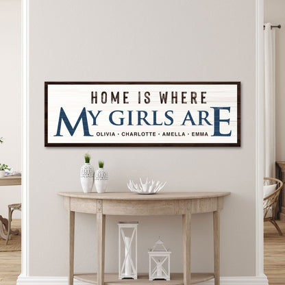 Tailored Canvases canvas sign Home Is Where My Girls Are in blue lettering with brown frame on Tampa Home & Garden Store